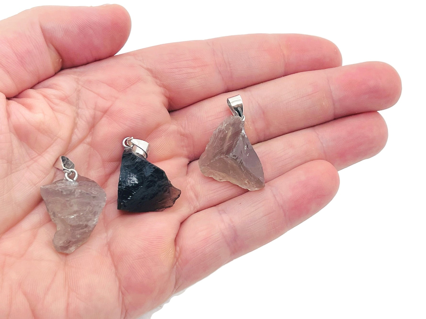 Smoky quartz crystal pendant from GemstoneGO featuring a polished teardrop-shaped gemstone on a silver chain.