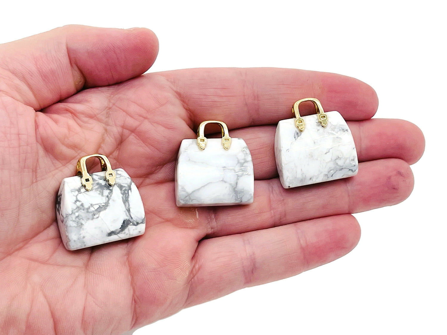Howlite crystal purse carving gemstone pendant featuring a detailed handbag design, perfect for jewelry and accessory crafting.