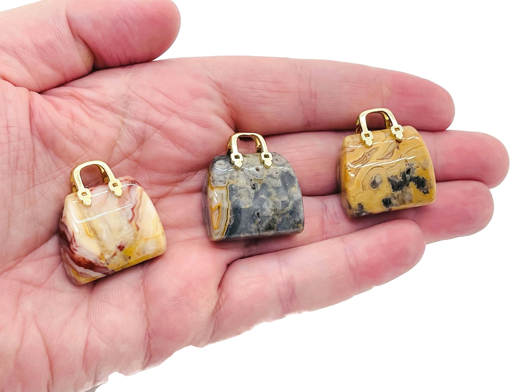 Crazy Lace Agate crystal purse carving gemstone pendant with intricate lace patterns, handcrafted by GemstoneGO.