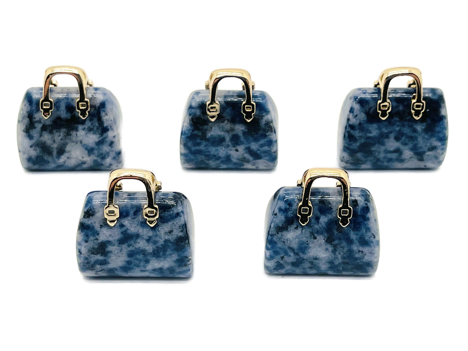 Blue Spot Jasper gemstone pendant featuring a carved purse design, perfect for jewelry or decorative use.