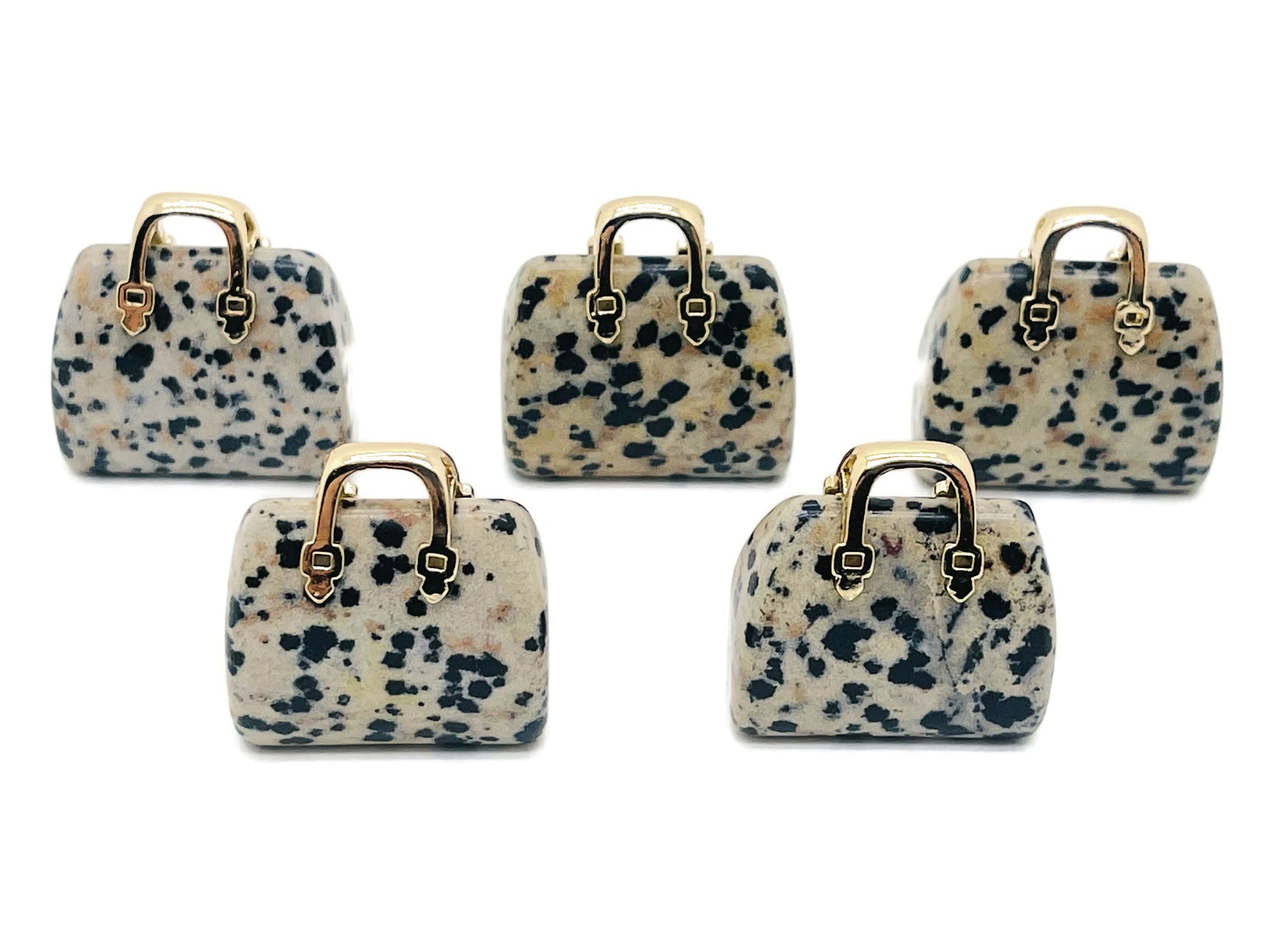 Dalmatian Jasper crystal handbag pendant featuring a detailed gemstone carving of a purse, by GemstoneGO.