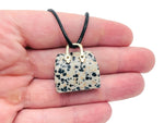 Dalmatian Jasper crystal handbag pendant featuring a detailed carved Dalmatian Jasper gemstone for jewelry or collection.