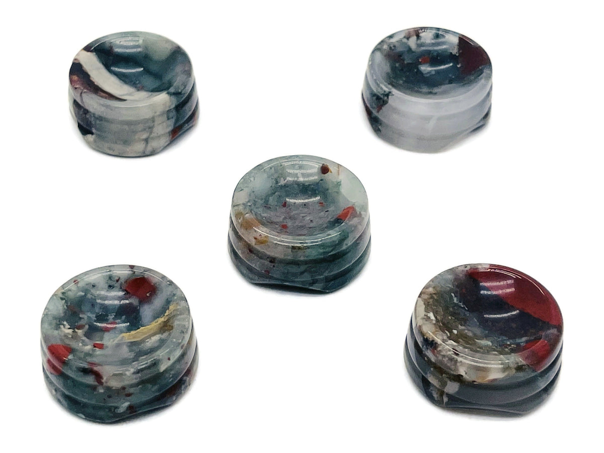 African Bloodstone crystal sphere on a carved stand, showcasing deep green and red gemstone with intricate detailing for home decor.