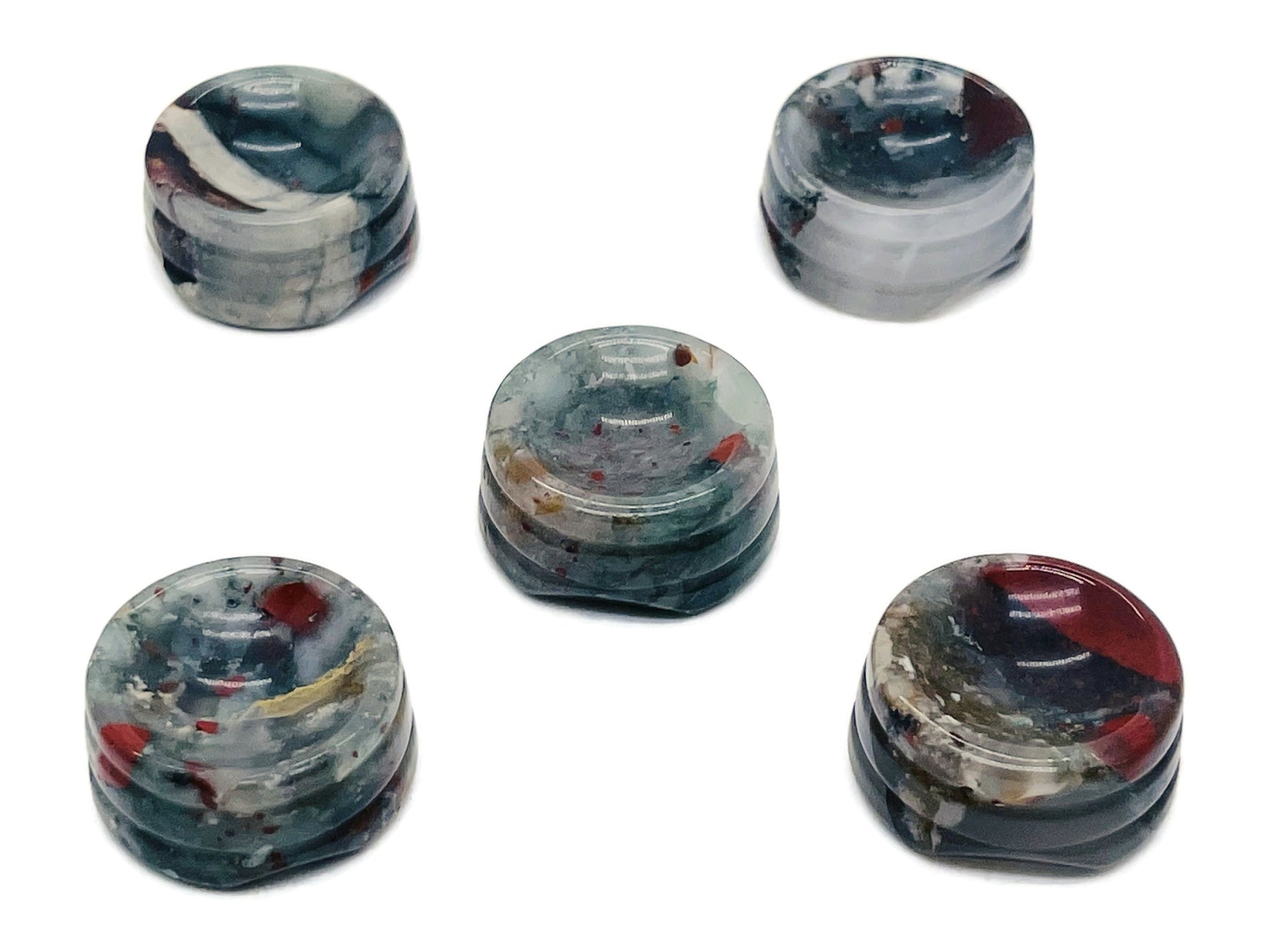 African Bloodstone crystal sphere on a carved stand, showcasing deep green and red gemstone with intricate detailing for home decor.