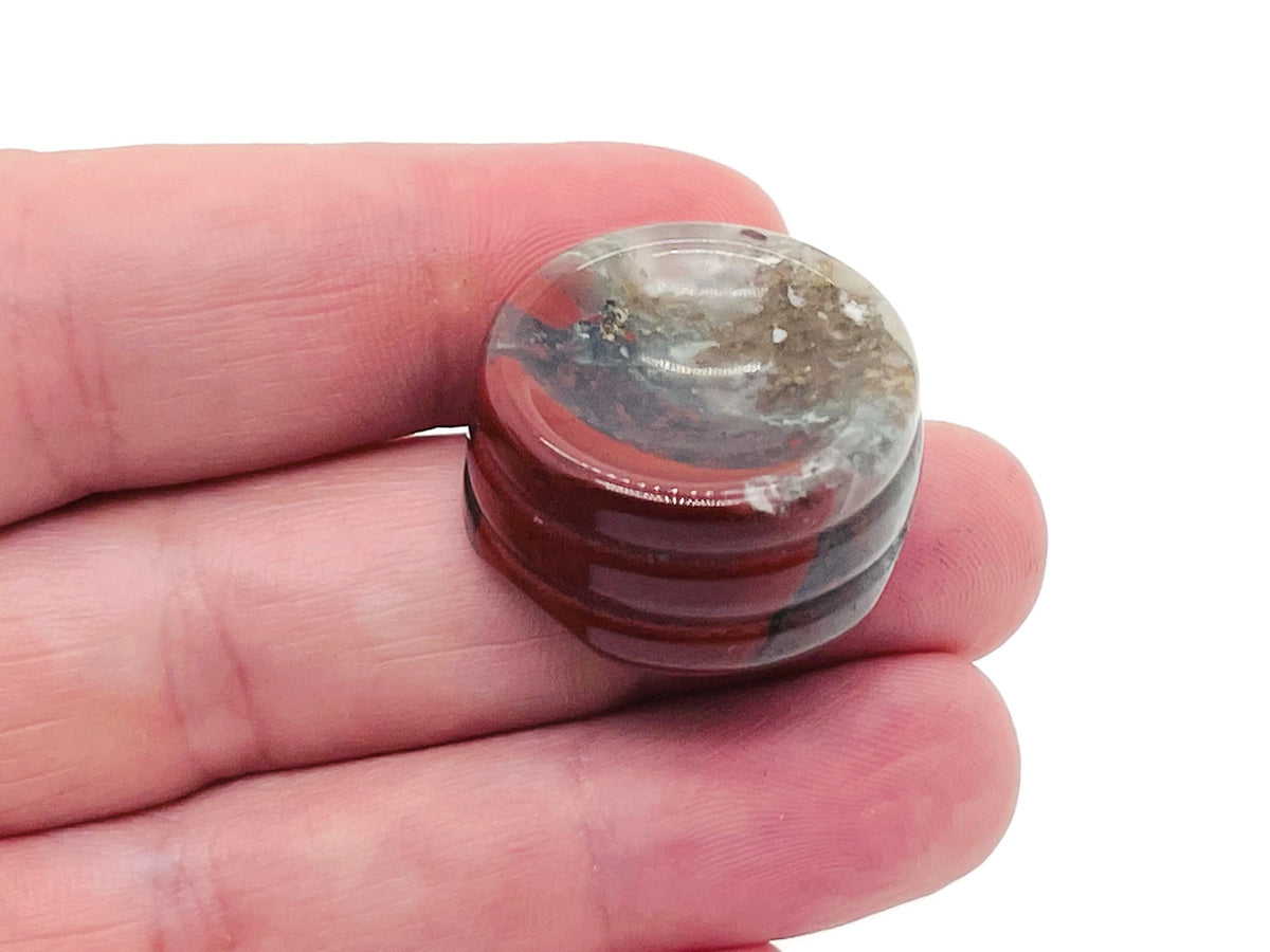 African Bloodstone crystal sphere on a carved gemstone stand, ideal for home decor, showcasing rich green and red mineral patterns.