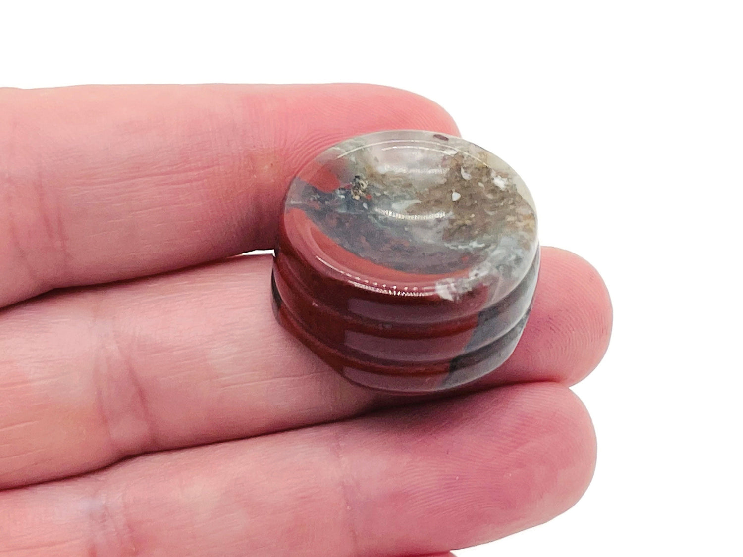 African Bloodstone crystal sphere on a carved gemstone stand, ideal for home decor, showcasing rich green and red mineral patterns.