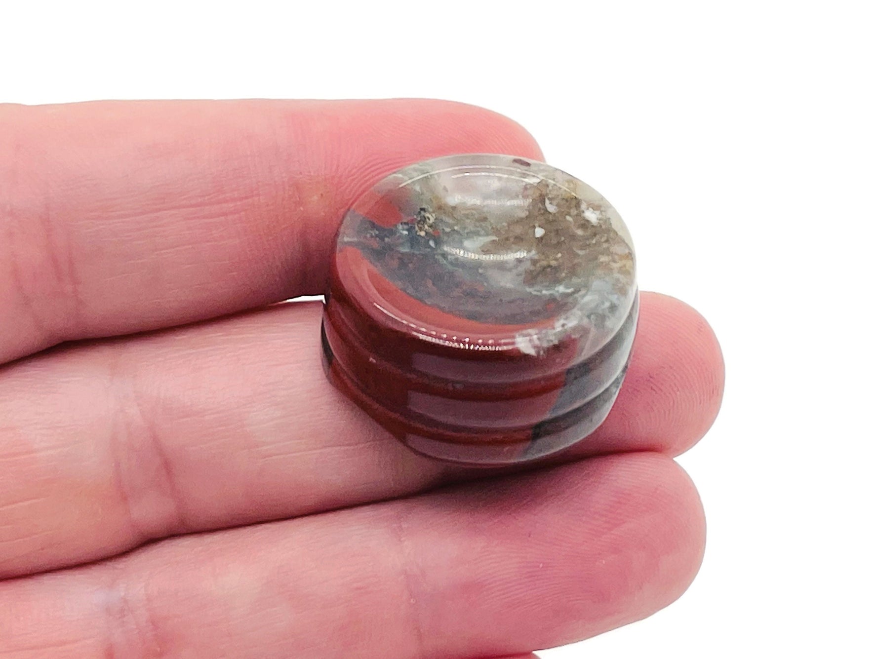 African Bloodstone crystal sphere on a carved gemstone stand, ideal for home decor, showcasing rich green and red mineral patterns.