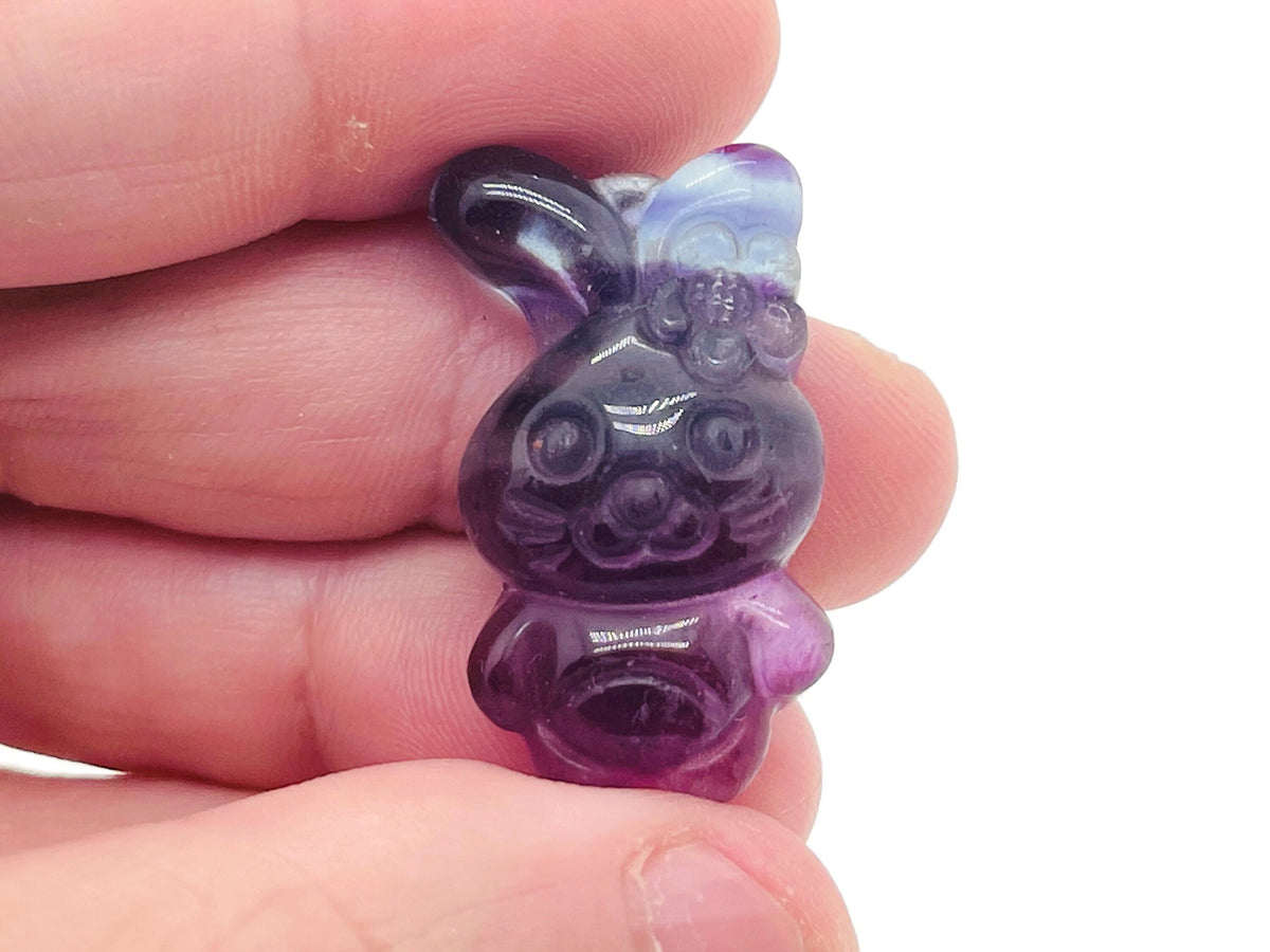 Fluorite rabbit gemstone carving by GemstoneGO, showing a colorful, polished rabbit figure made from vibrant fluorite stone.