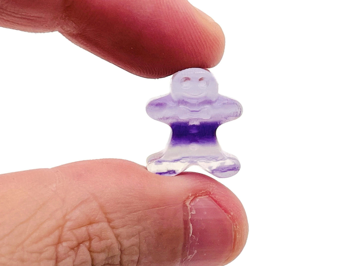 Fluorite gingerbread cookies carving gemstone from GemstoneGO, showcasing vibrant green and purple mineral patterns.