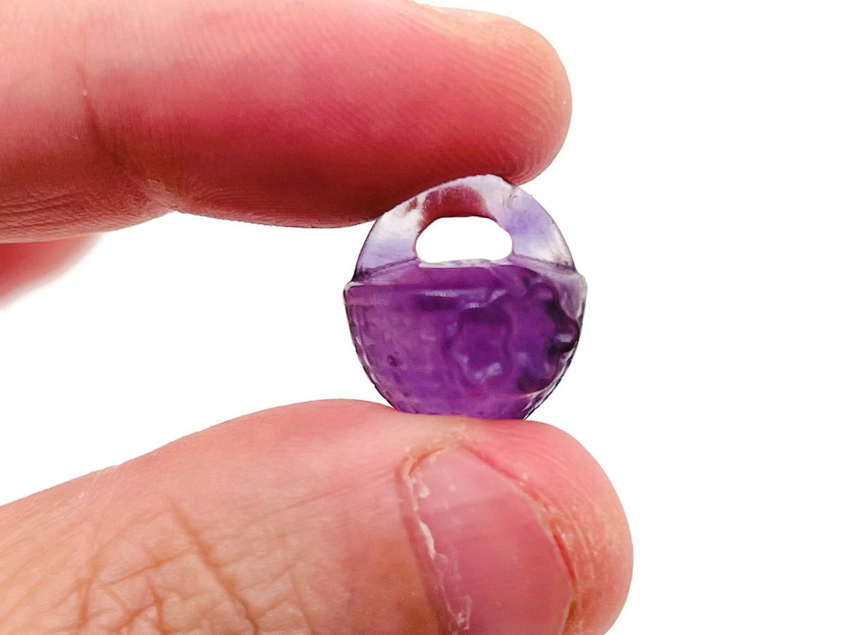 Fluorite garden basket carving gemstone by GemstoneGO, featuring intricate floral design and vibrant purple-green hues.