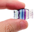 Colorful fluorite candy carving gemstone from GemstoneGO showcasing vibrant green and purple hues with smooth polished surfaces.