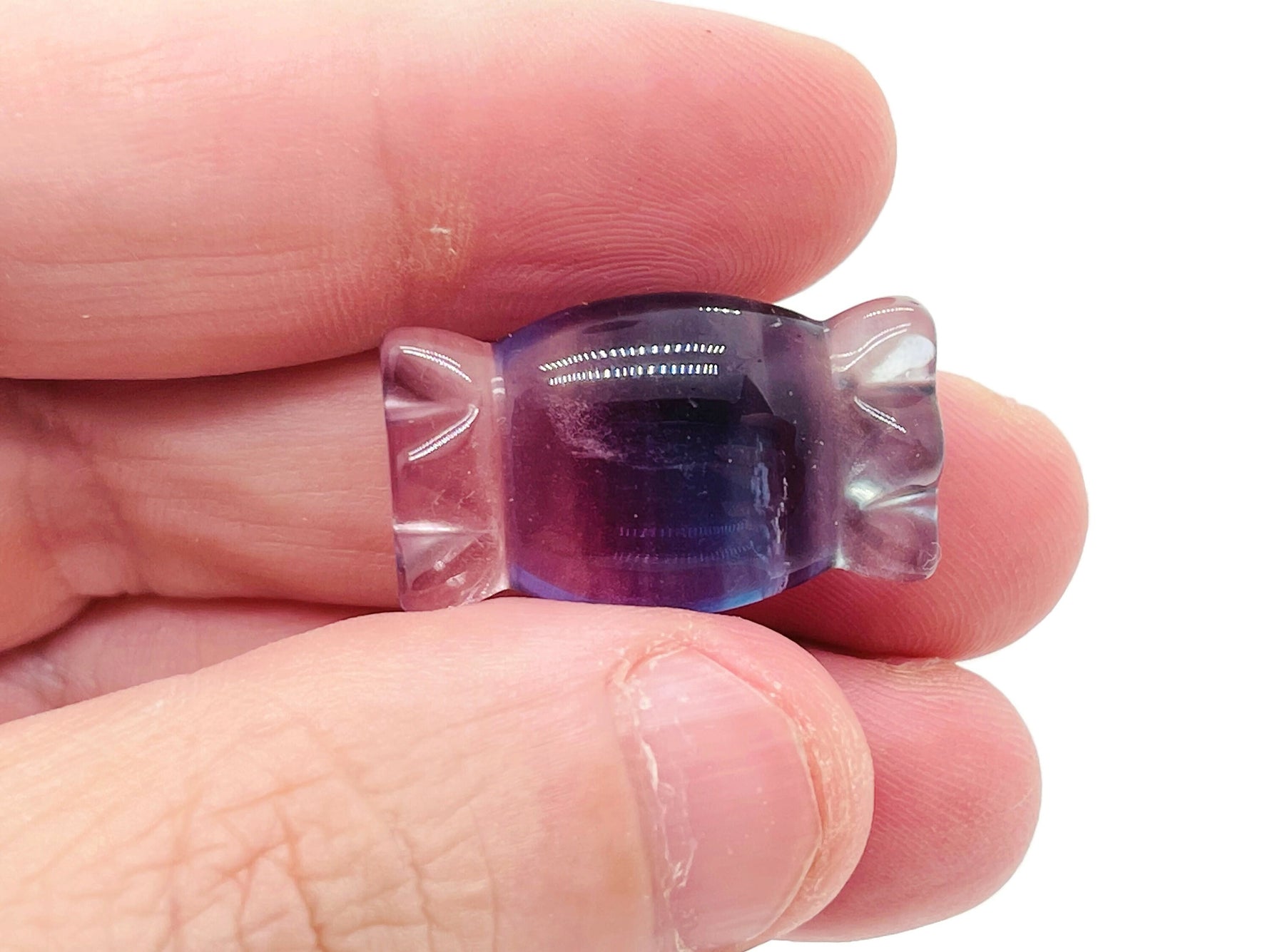 Fluorite candy carving gemstone from GemstoneGO, showing vibrant purple and green layered mineral with smooth polished surfaces.