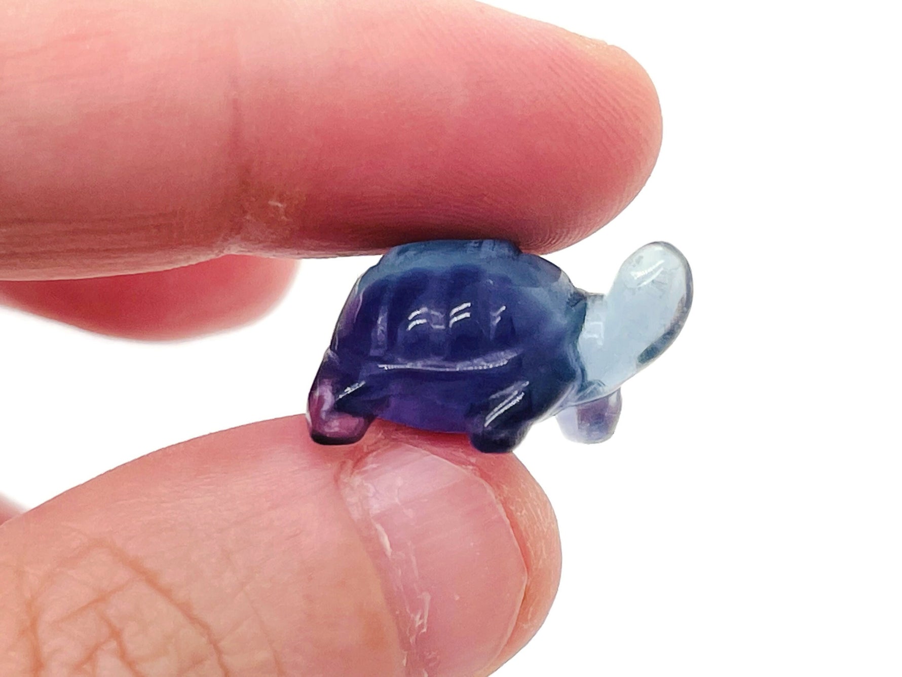 Mini fluorite turtle gemstone carving by GemstoneGO, featuring vibrant purple and green hues with detailed shell and head details.