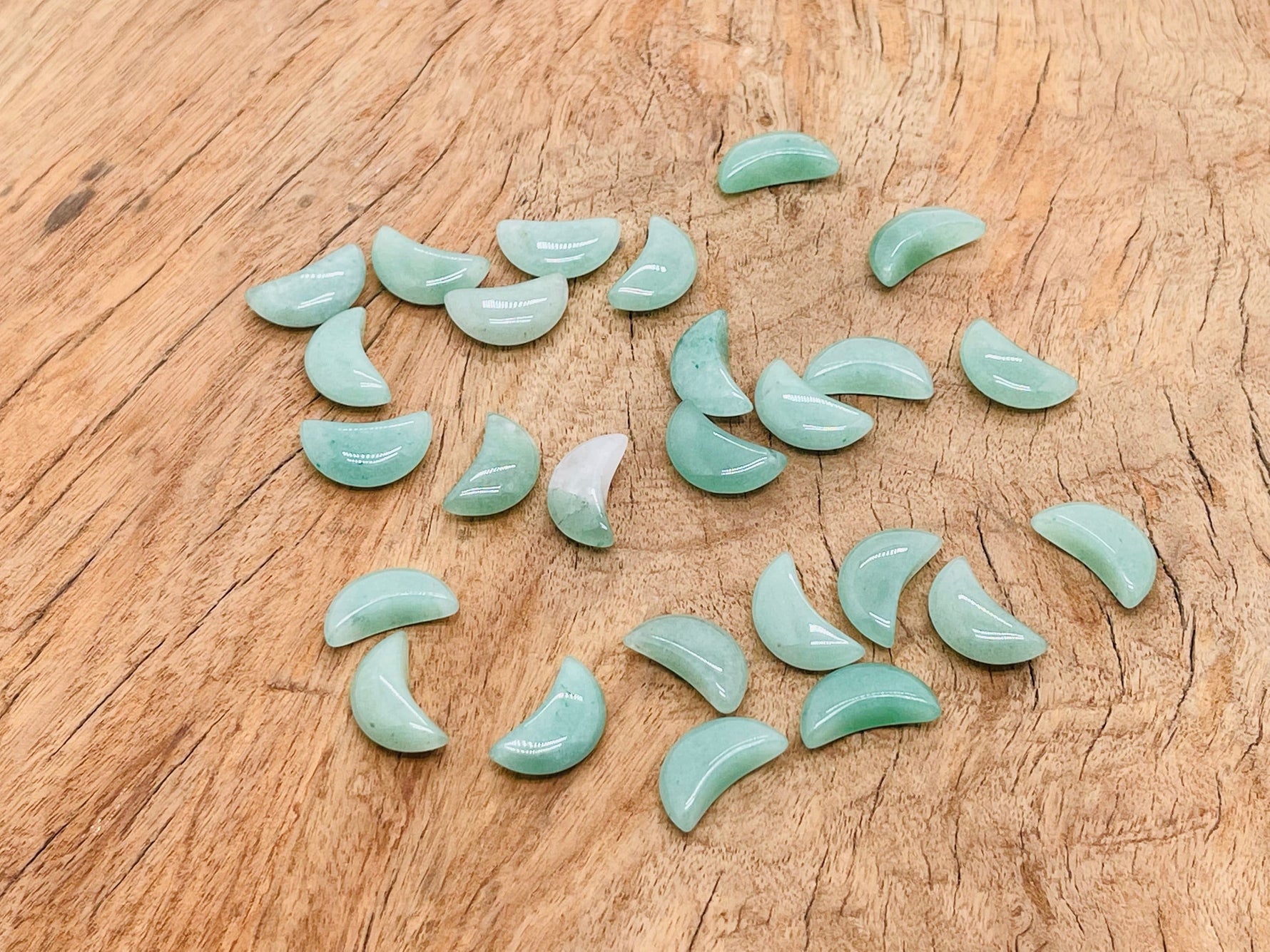 A 20mm Aventurine gemstone moon pendant by GemstoneGO, showcasing a smooth, polished green stone with moon-shaped carving.