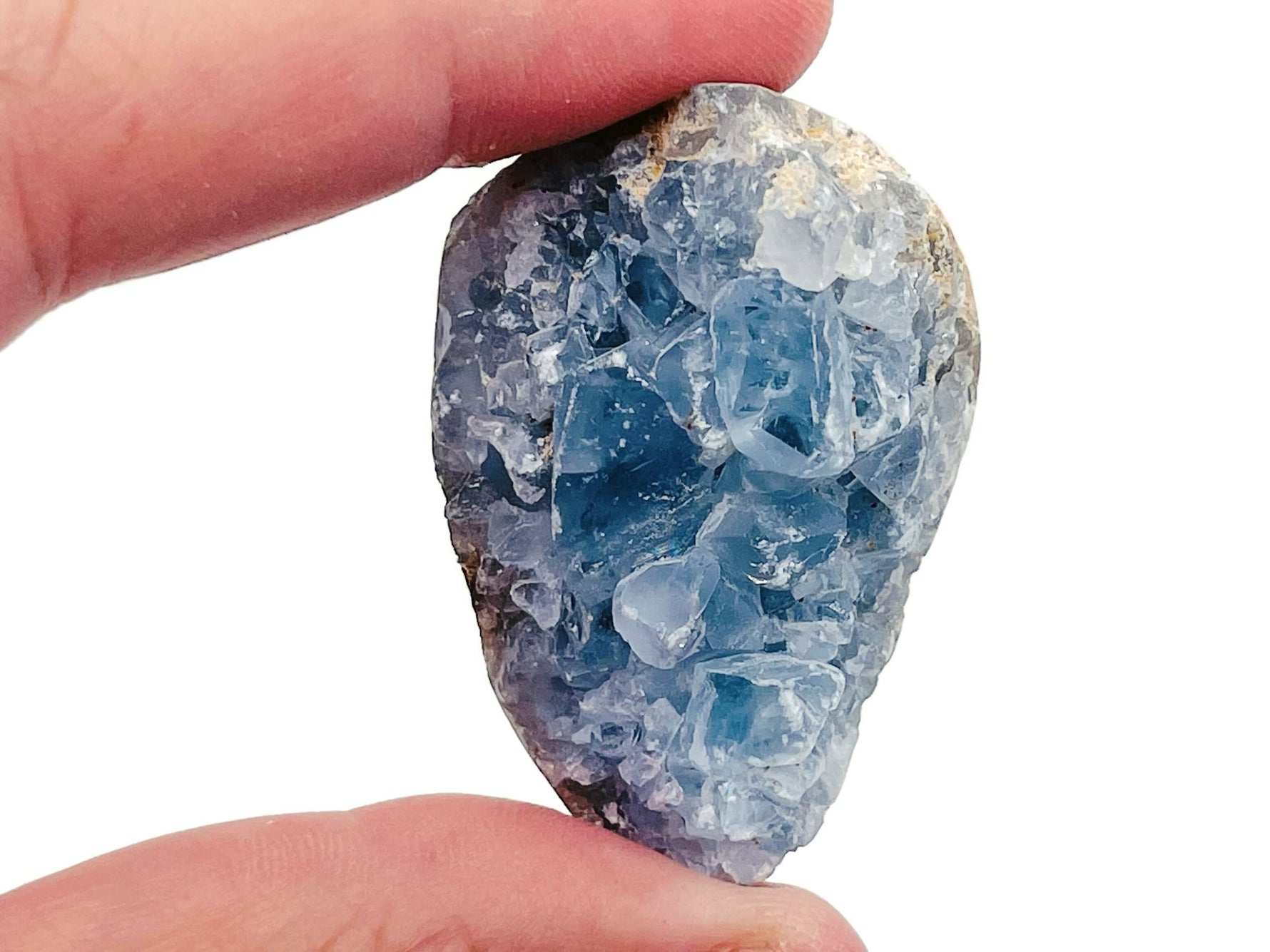 Raw celestite gemstone cluster featuring light blue crystalline formations, natural mineral textures, and a rough, unpolished appearance.