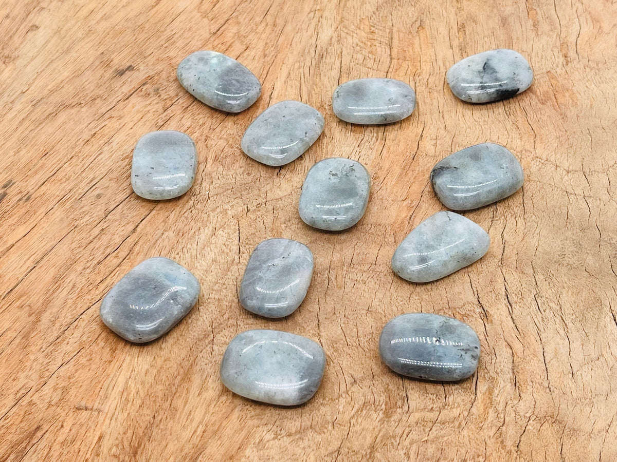 Labradorite flat gemstone slab from GemstoneGO showcasing iridescent blue and green hues in a smooth polished surface.