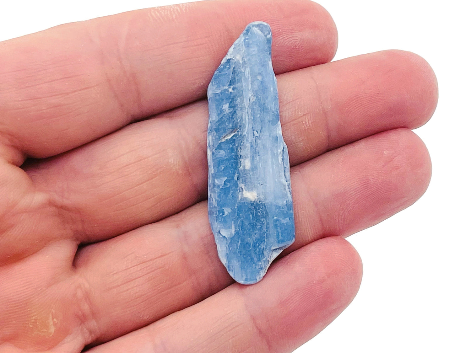Raw Kyanite gemstone from GemstoneGO, showing its natural blue mineral crystal with rough, unpolished appearance.