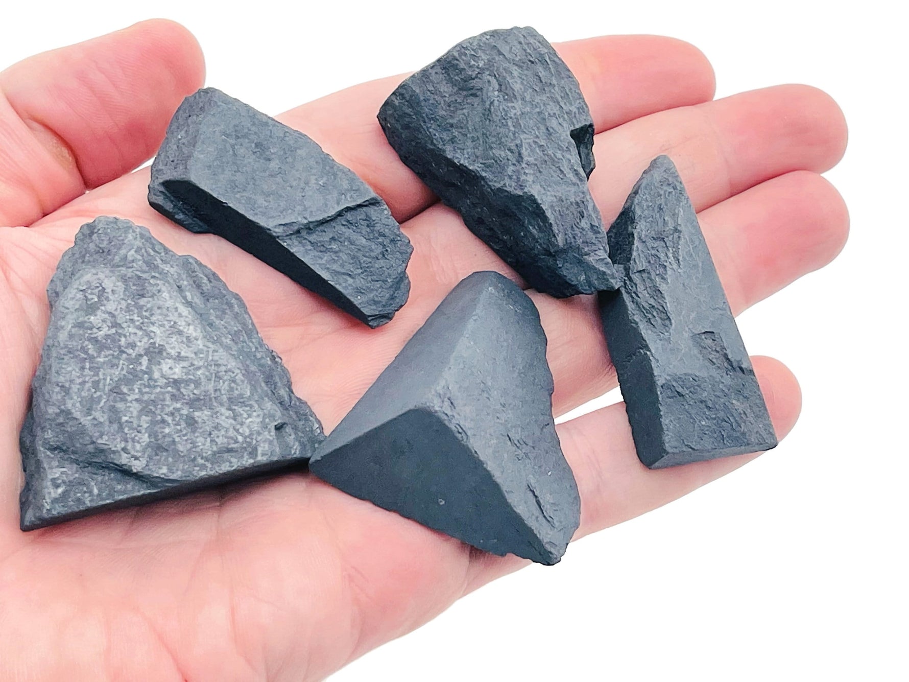 Raw Shungite gemstone from GemstoneGO, showcasing its dark, textured, natural mineral appearance with rough edges.