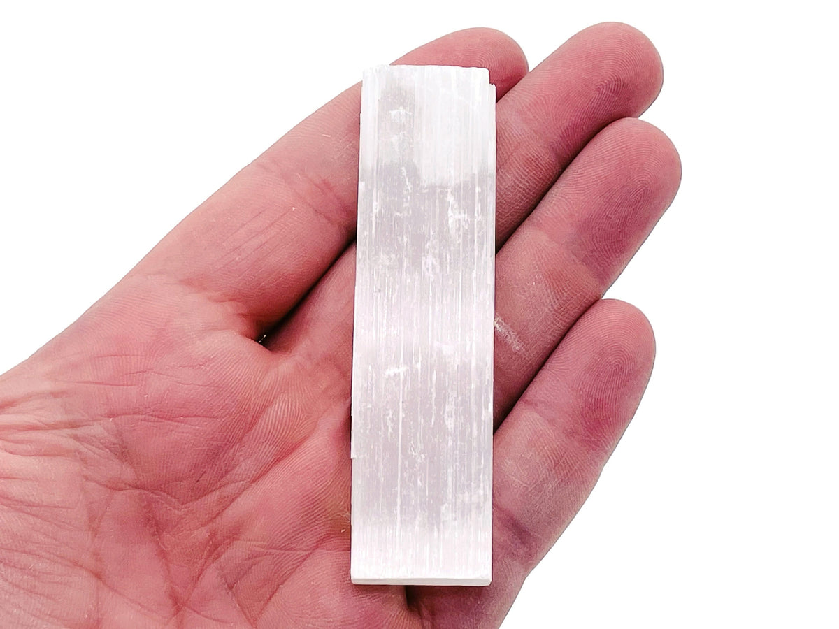Raw Selenite wand in various lengths from GemstoneGO, showcasing its translucent, natural stick shape and smooth surface.