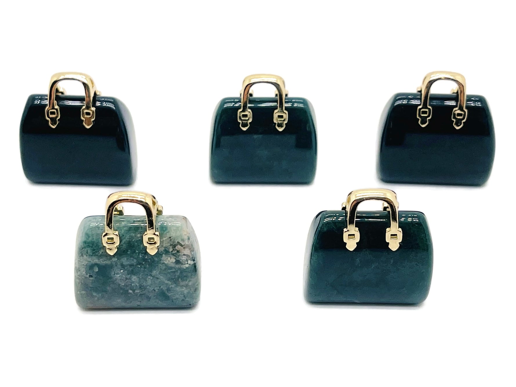 Moss agate crystal handbag pendant carved from gemstone, featuring intricate details and natural green and brown patterns.