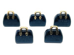 Blue Goldstone crystal handbag pendant with gold accents, carved gemstone showcasing detailed craftsmanship and vibrant blue sparkle.