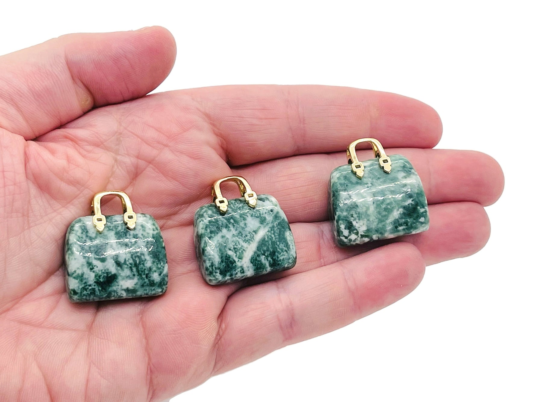 Green Jade crystal handbag pendant featuring a carved green dot design, perfect for jewelry and accessory embellishments.
