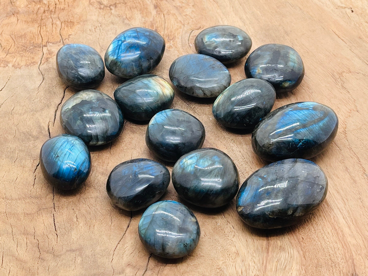 Labradorite palm gemstone spa stone by GemstoneGO, smooth polished gemstone with iridescent blue and green hues for relaxation.