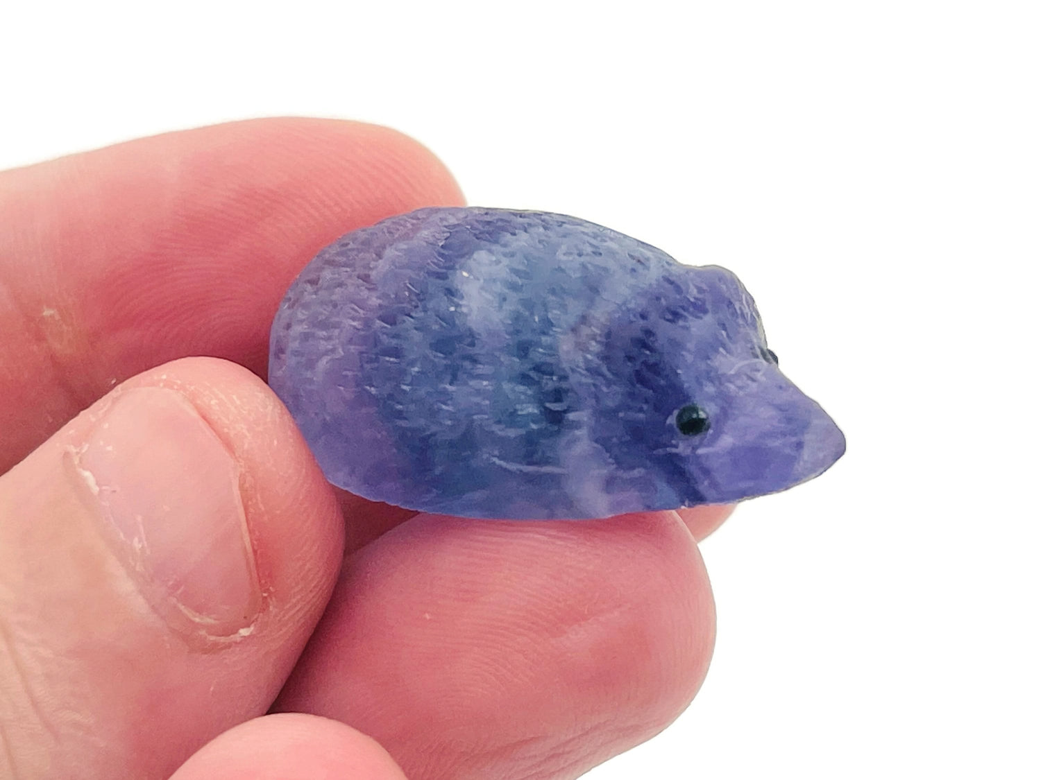 Fluorite hedgehog gemstone carving by GemstoneGO, showcasing vibrant purple and green colors with detailed stone craftsmanship.
