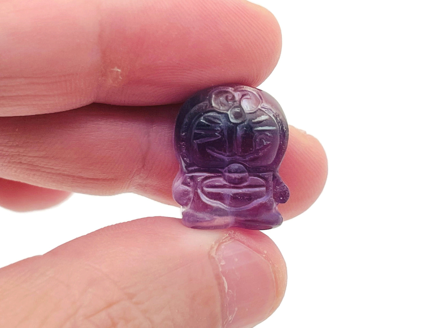 Fluorite cat carving gemstone from GemstoneGO, showing a vibrant multicolored feline sculpture with polished surface and detailed features.