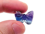 Fluorite butterfly gemstone carving by GemstoneGO showing a colorful, detailed butterfly shape with vibrant purple and green hues.