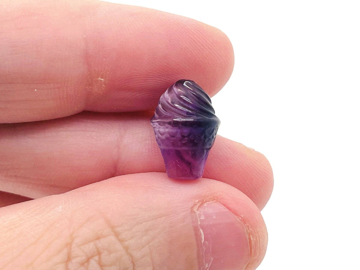 Fluorite ice cream-shaped gemstone carving by GemstoneGO, vibrant green and purple hues, detailed and polished decorative stone