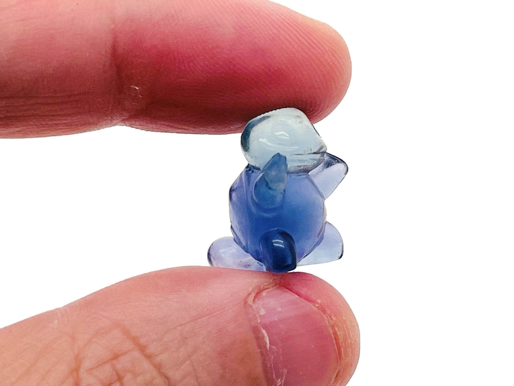 Fluorite tortoise gemstone carving by GemstoneGO, showing vibrant purple and green hues with detailed shell and body features.