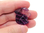 Fluorite squirrel gemstone carving from GemstoneGO, detailed multicolored mineral sculpture of a squirrel on a smooth base.