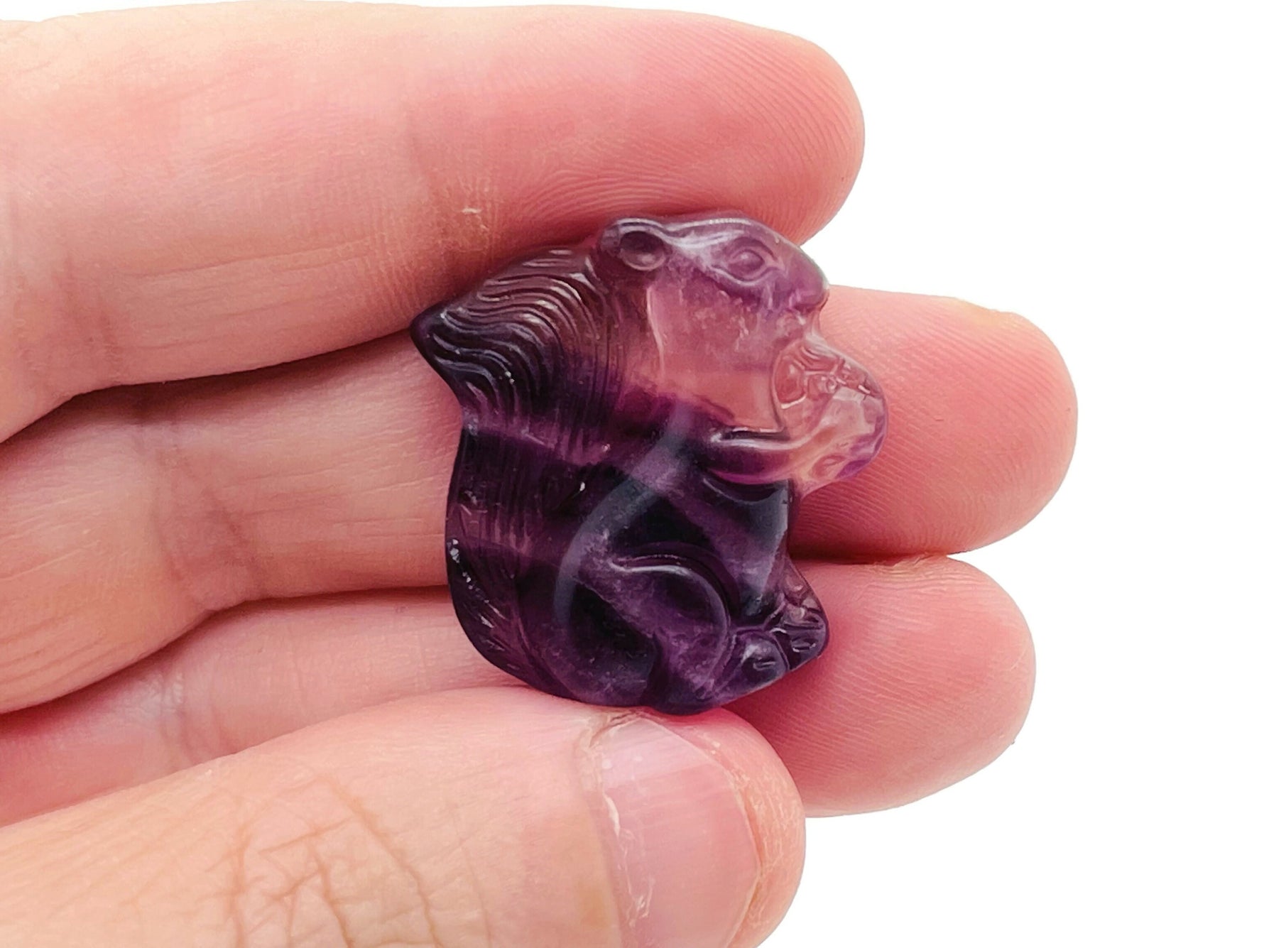 Fluorite squirrel gemstone carving from GemstoneGO, detailed multicolored mineral sculpture of a squirrel on a smooth base.