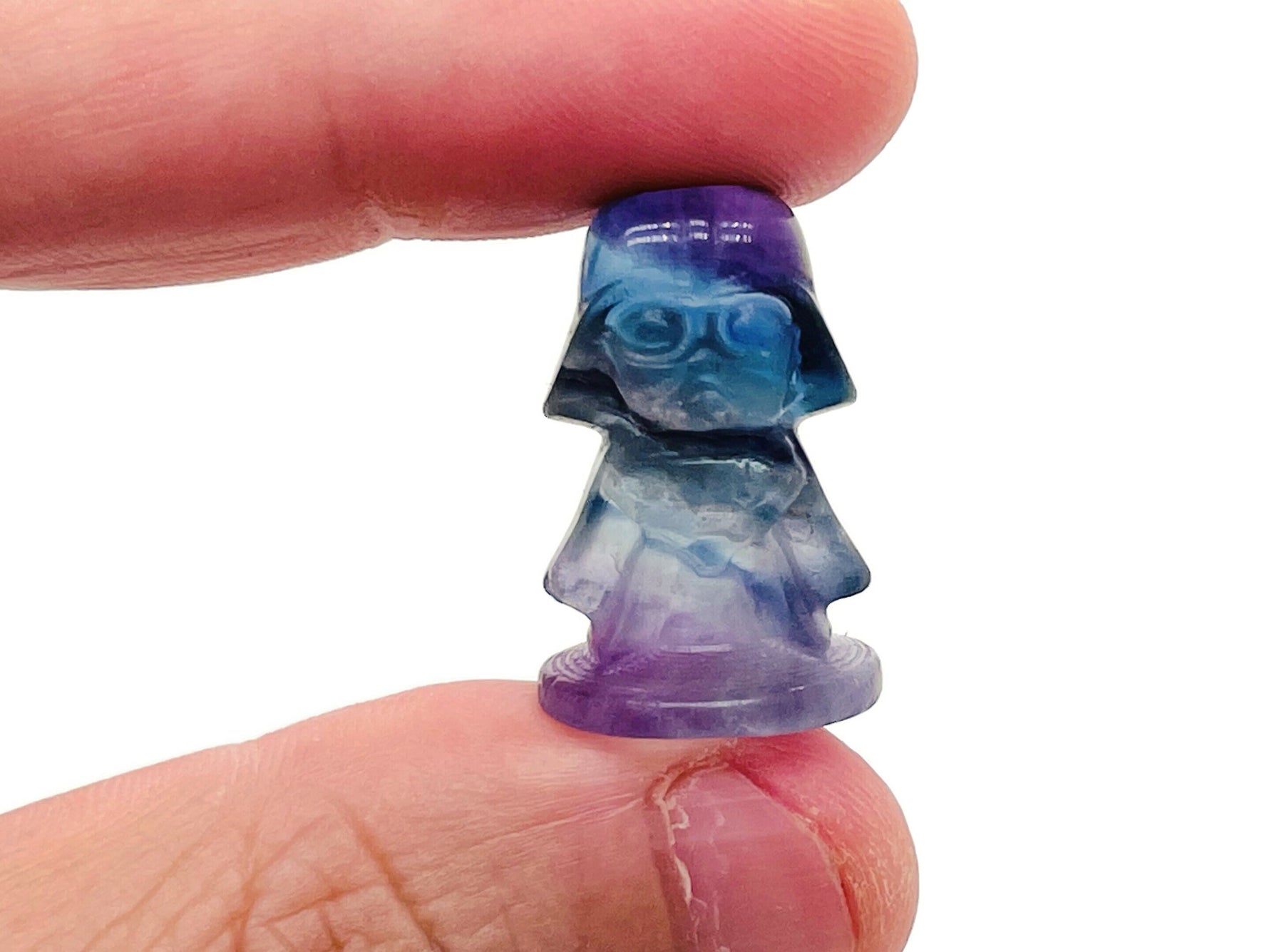 Fluorite Darth Vader carving gemstone by GemstoneGO, featuring a detailed Star Wars character figure in vibrant purple and green hues.