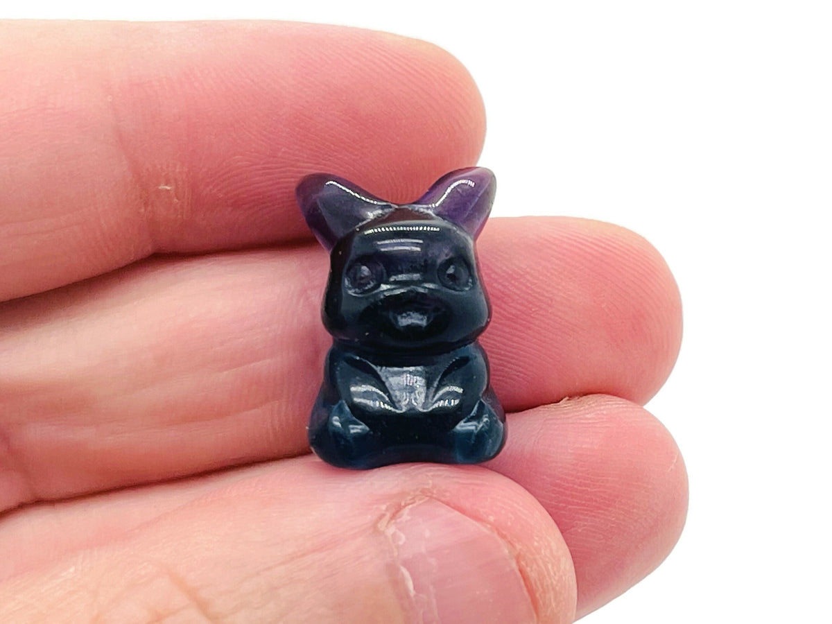 Cute fluorite gemstone carving of an animal, showcasing vibrant colors and detailed craftsmanship from GemstoneGO.
