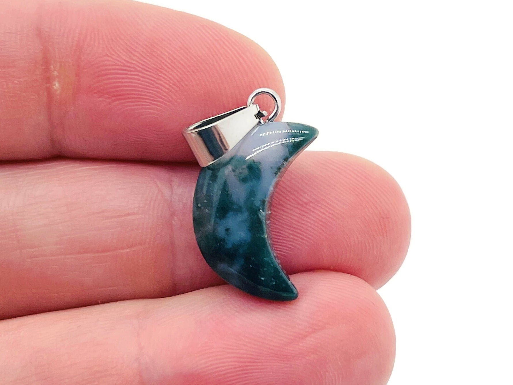 Moss Agate crystal pendant from GemstoneGO, showcasing a polished green and brown gemstone with a silver bail for jewelry making.