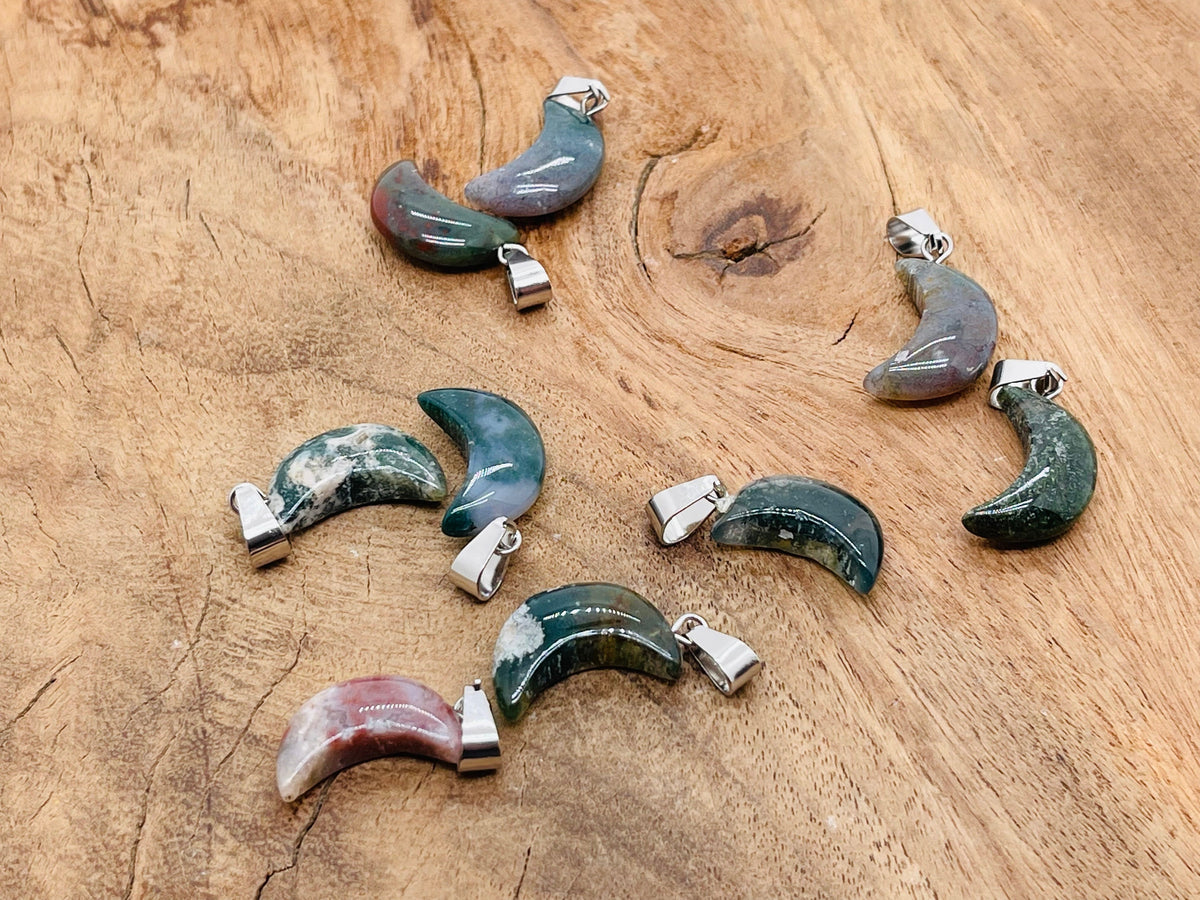 Moss agate crystal pendant from GemstoneGO, featuring a natural stone with green and brown moss-like patterns for jewelry making.