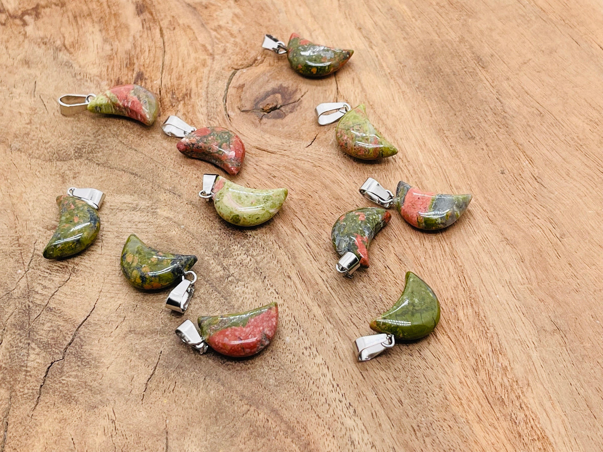 Unakite moon crystal pendant from GemstoneGO, featuring a polished unakite gemstone in a moon shape, ideal for jewelry making.