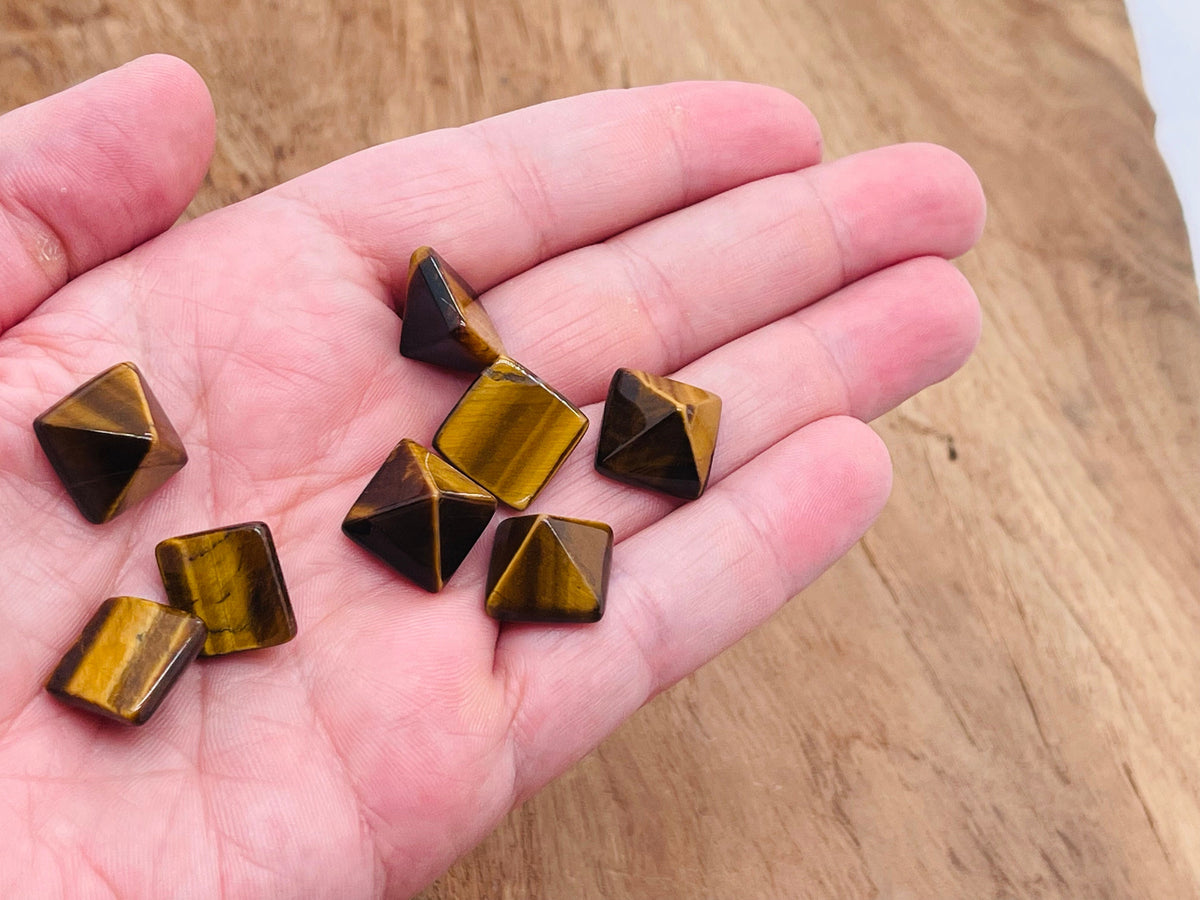 14mm Tiger Eye pyramid gemstone carving by GemstoneGO, showcasing a polished golden-brown stone with natural banding and smooth facets.