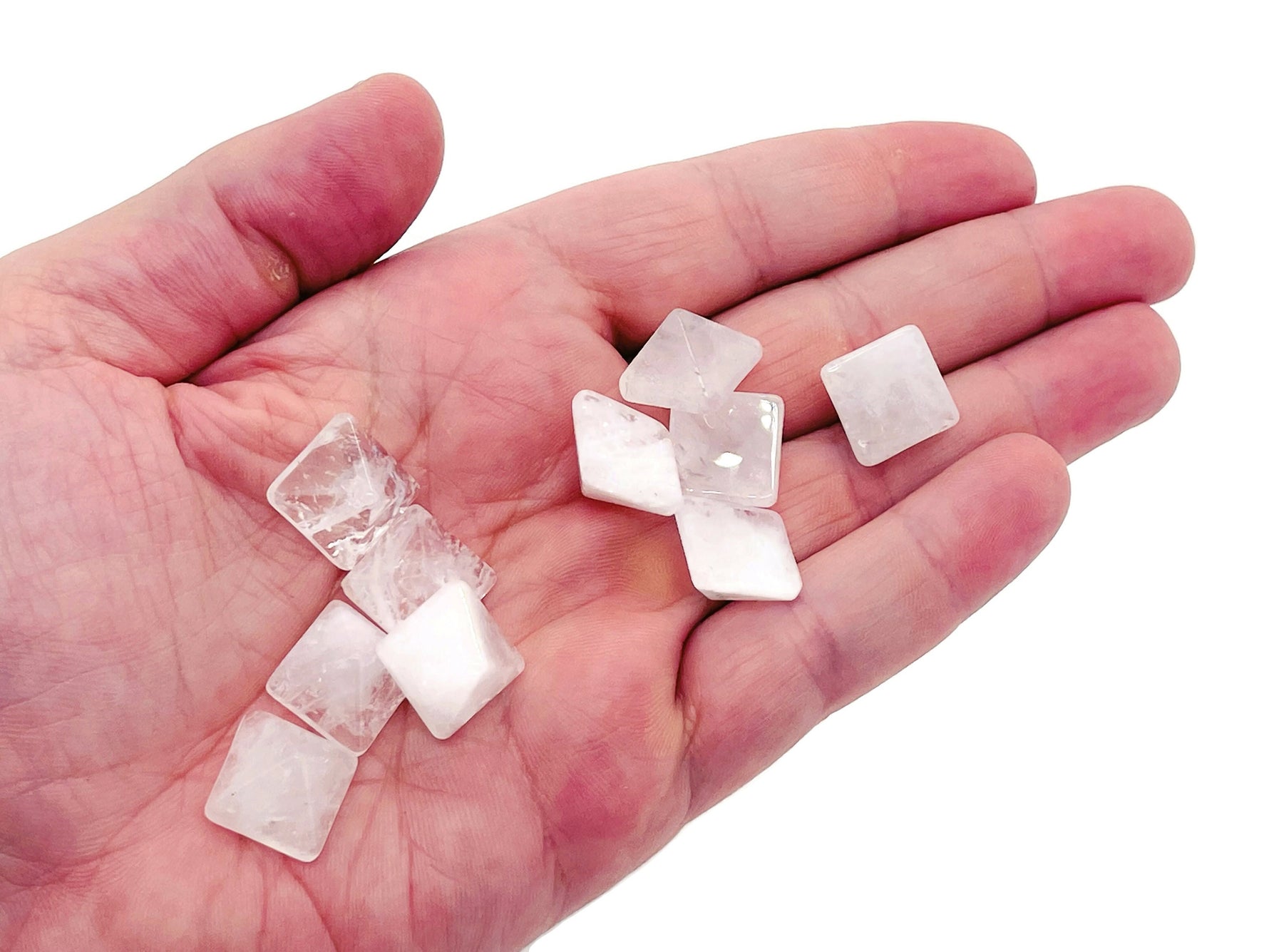 Clear Quartz pyramid gemstone carving, 14mm, from GemstoneGO, showing a polished, translucent pyramid with natural crystal features.