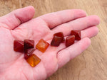 14mm Carnelian pyramid gemstone carving from GemstoneGO, showcasing vibrant orange color and smooth pyramid shape.