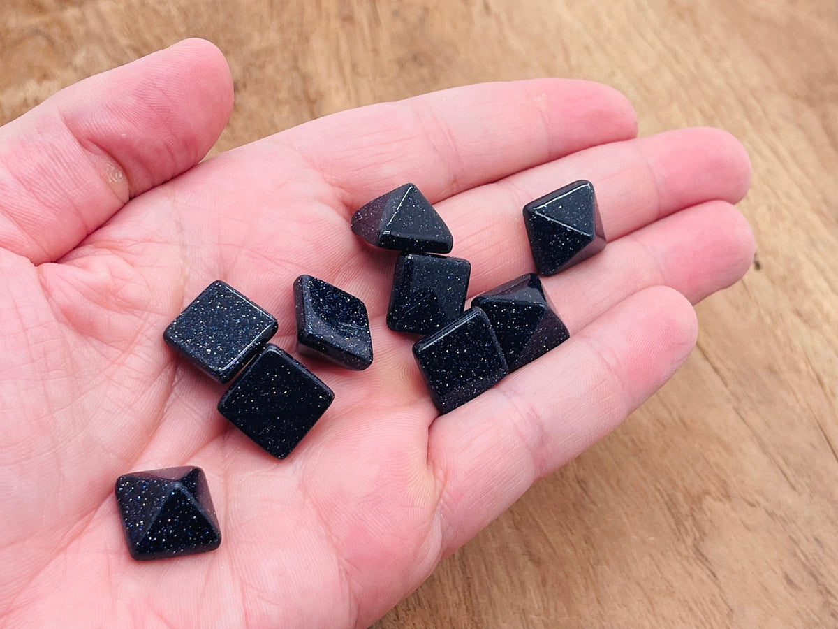 Blue Goldstone pyramid gemstone carving, 14mm, from GemstoneGO, showcasing a polished, vibrant blue and gold sparkling stone.