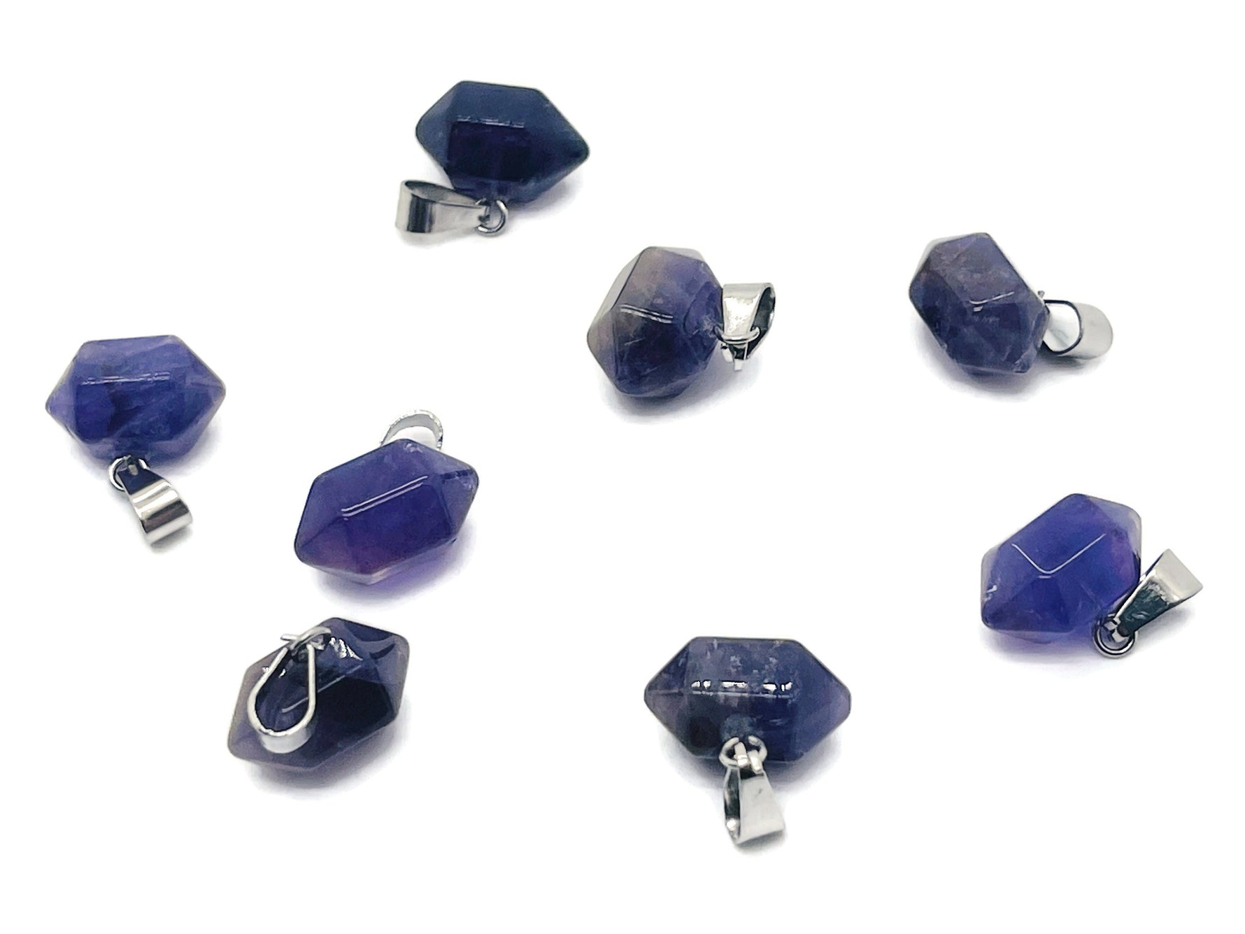 Amethyst point crystal pendant from GemstoneGO, showcasing a purple gemstone with natural facets for jewelry making.