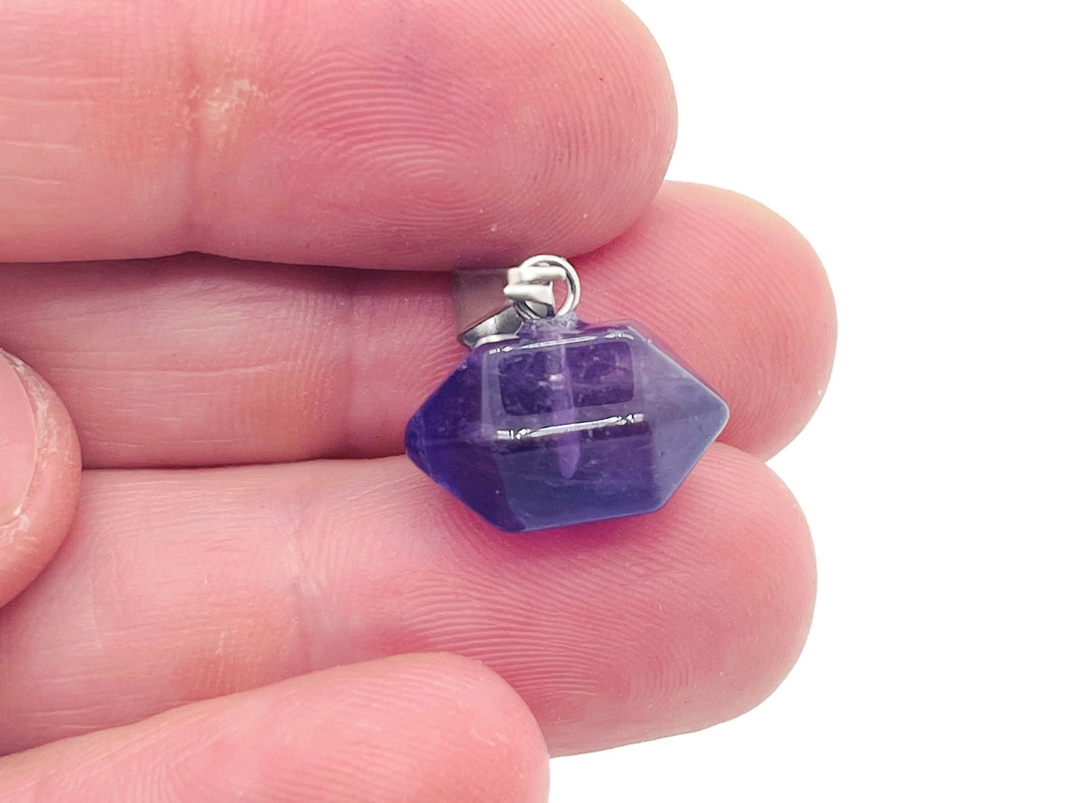 Amethyst point crystal pendant from GemstoneGO, showcasing a purple gemstone with a metal bail for jewelry making.