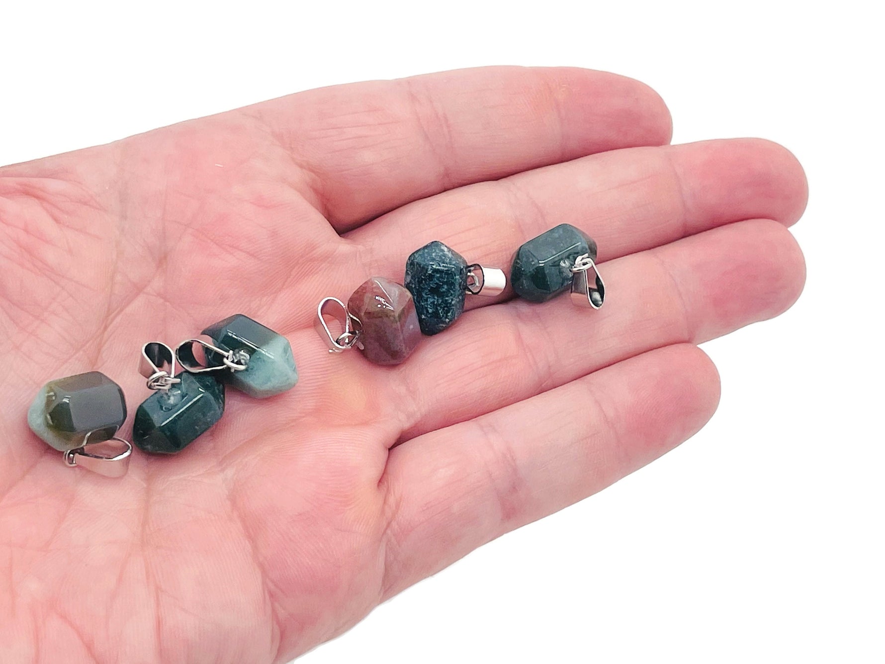 Moss agate point crystal pendant from GemstoneGO, used for jewelry making, showcasing a green and brown patterned gemstone on a string