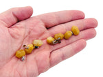 Yellow jade point crystal pendant from GemstoneGO, featuring a polished yellow jade stone with a pointed shape for jewelry making.