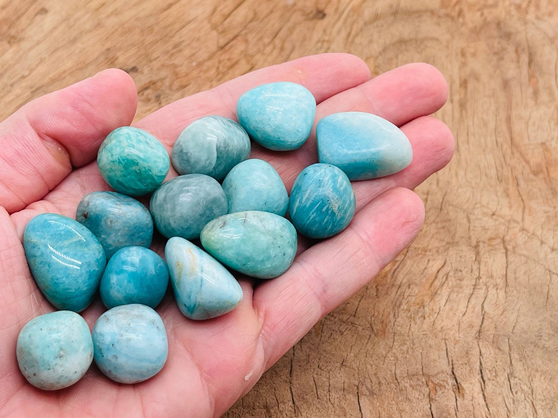 Amazonite tumbled stone from GemstoneGO, smooth blue-green mineral with natural patterns, ideal for jewelry or healing practices.