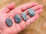Labradorite flat gemstone slab from GemstoneGO showing iridescent blue and green hues with natural stone patterns.