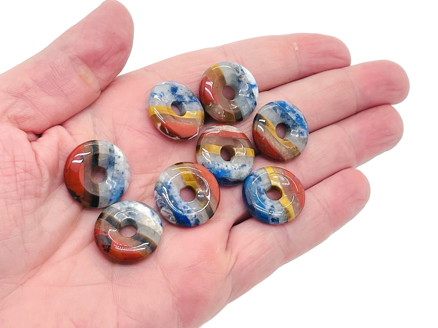 7 Chakra crystal donut pendant with pi stone, 20mm, featuring vibrant gemstone colors and intricate detailing.
